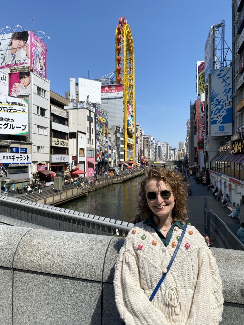 Lucy in Dotenbori. You can see the canal and the big signs