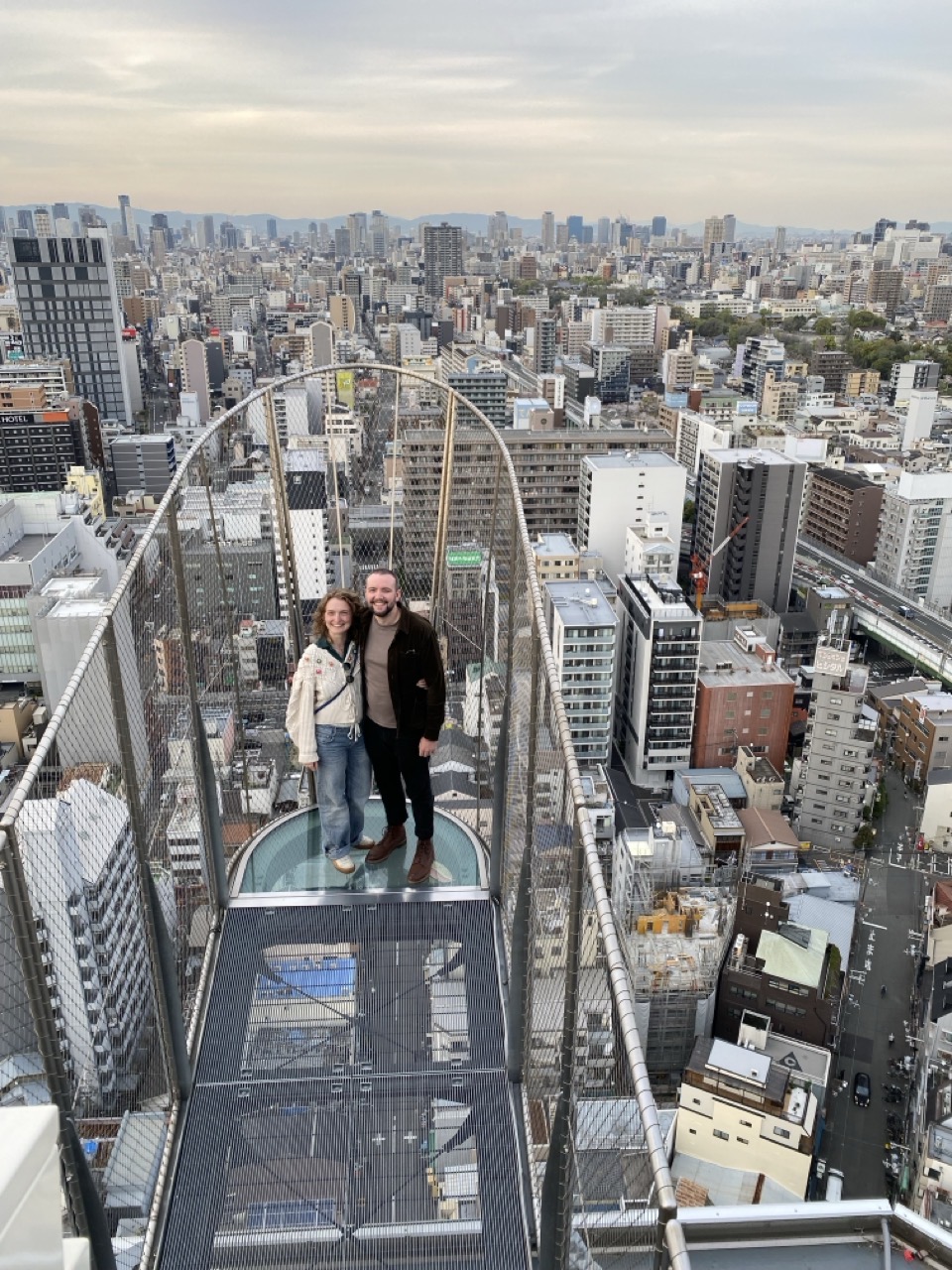 Me and Lucy at the top of the tower with a view of the city behind us