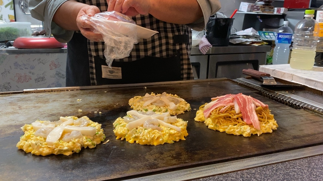 Okonomiyaki being made on the hot plate. The chef/owner was really lovely