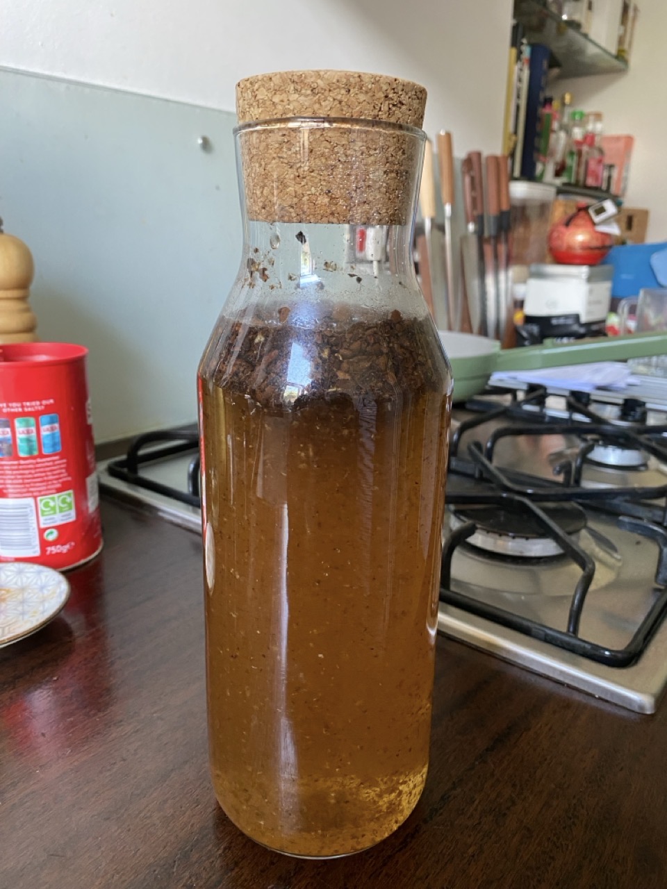 The bottle, corked. This goes in the fridge and the residue should settle to the bottom overnight.