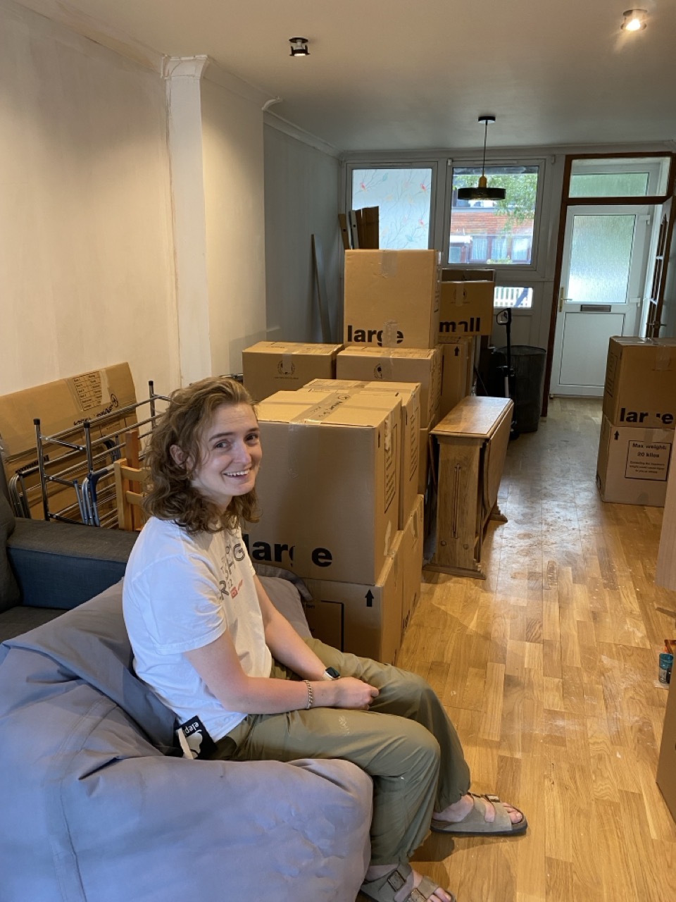 Lucy with loads of boxes