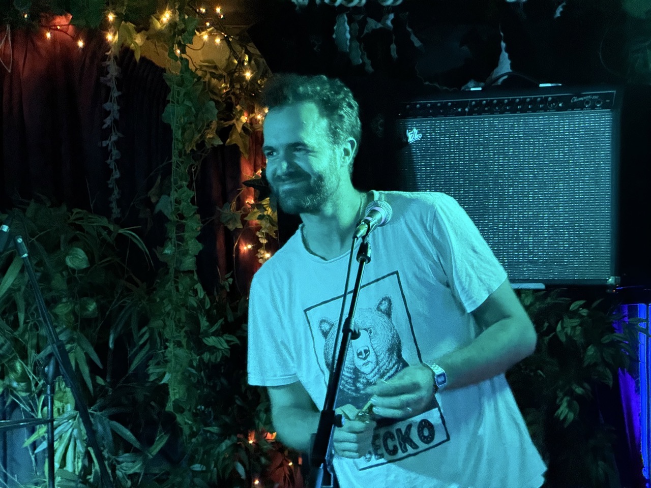 Chris holding a kazoo looking delighted to be there