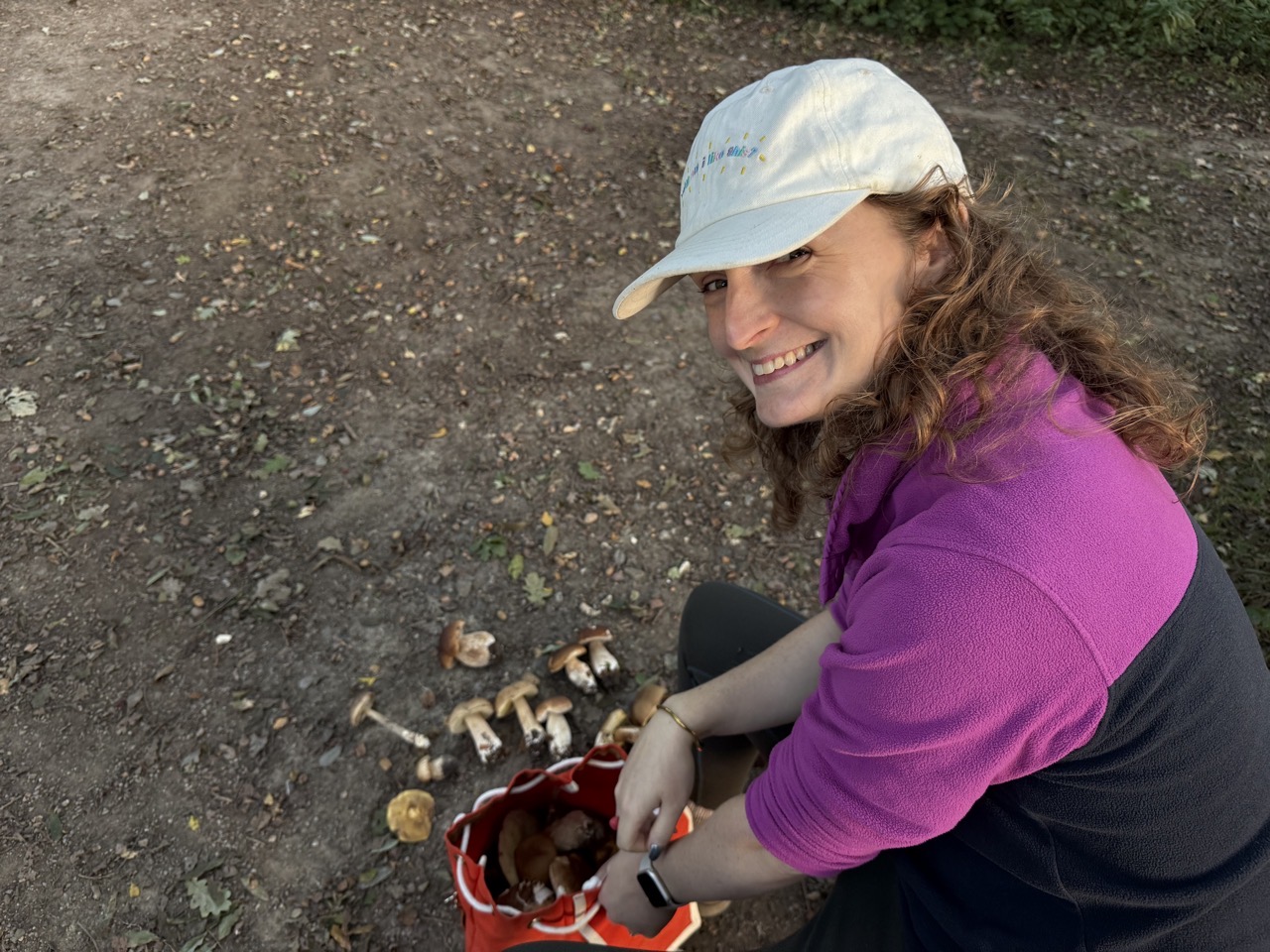 Lucy with a backpack full of mushrooms